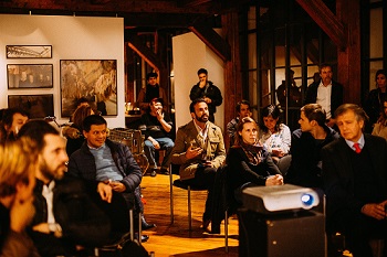 people sitting in a room having a discussion